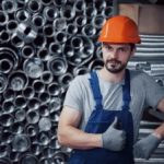 portrait-young-worker-hard-hat-large-metalworking-